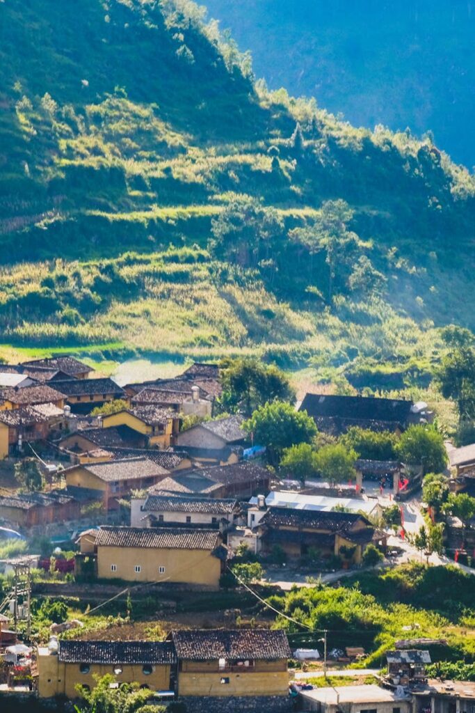 A picturesque village in Hà Giang, Vietnam, nestled among lush mountains and greenery.